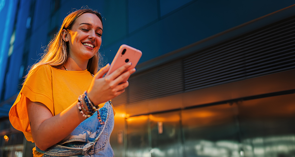 CopySpaceOneHappyYoungGirlUsingHerSmartphoneTo | Evok Advertising Social First Marketing in 2025